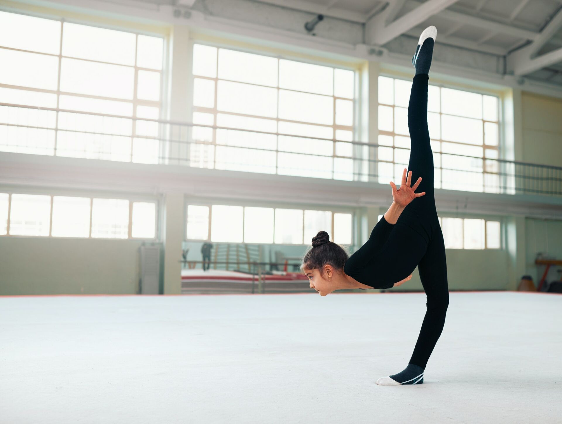 gymnast performs a balance with split.